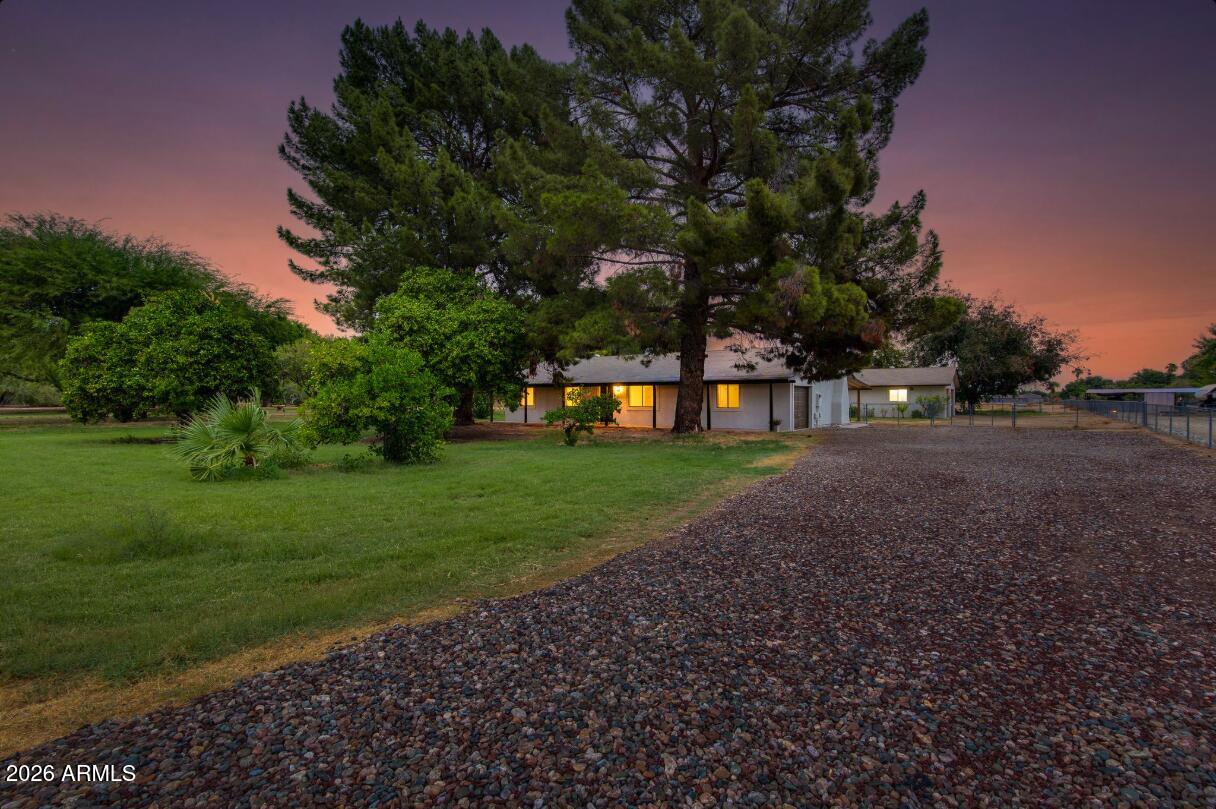 7101 North Perryville Road Waddell, AZ 85355 - Photo 3 of 66 7101 N Perryville street twilight 6