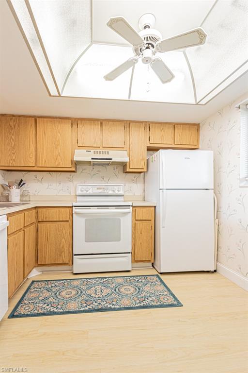 1022 Manatee Road, Unit D107 Naples, FL 34114 - Photo 21 of 43 a kitchen with a white cabinets stove and refrigerator