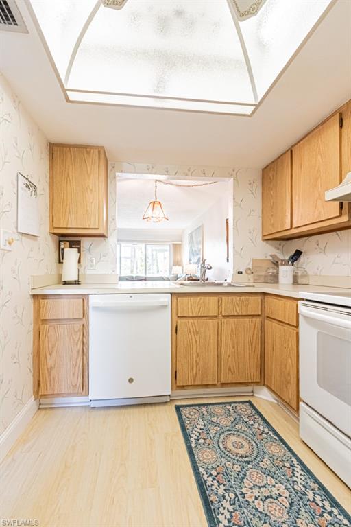 1022 Manatee Road, Unit D107 Naples, FL 34114 - Photo 25 of 43 a kitchen with granite countertop a sink cabinets and window