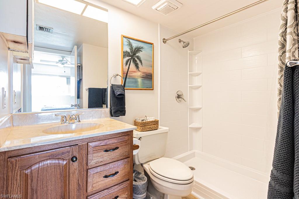 1022 Manatee Road, Unit D107 Naples, FL 34114 - Photo 31 of 43 a bathroom with a sink a toilet and a bathtub