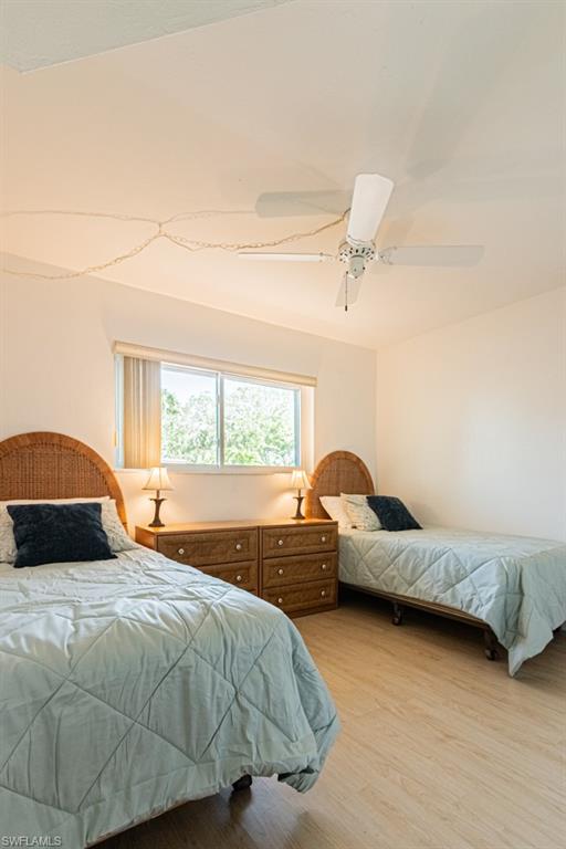 1022 Manatee Road, Unit D107 Naples, FL 34114 - Photo 37 of 43 a bedroom with a bed and a couch