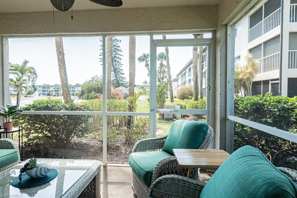 1022 Manatee Road, Unit D107 Naples, FL 34114 - Photo 4 of 43 a balcony with furniture and a potted plant
