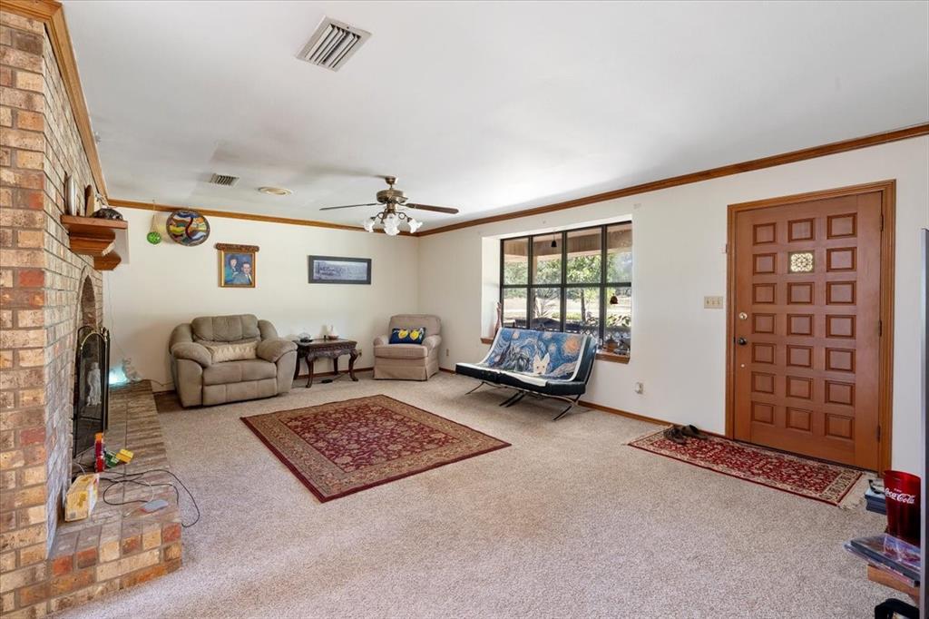 705 West Saunders Street Trenton, TX 75490 - Photo 16 of 37 a living room with furniture rug and window