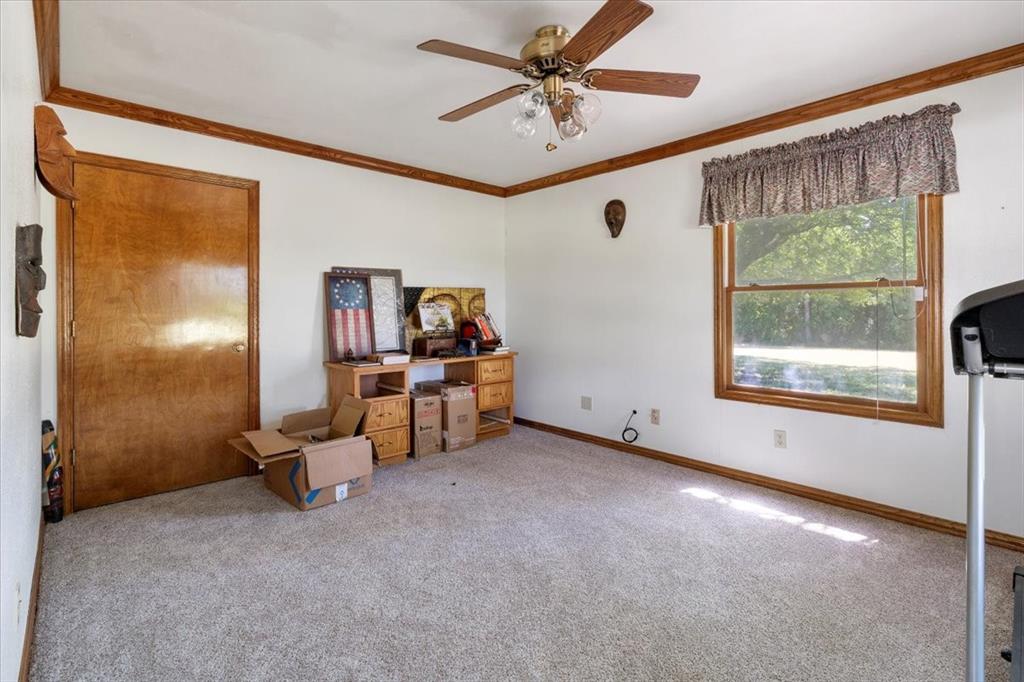 705 West Saunders Street Trenton, TX 75490 - Photo 21 of 37 a view of livingroom with furniture and a window