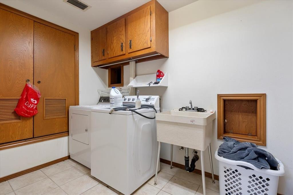 705 West Saunders Street Trenton, TX 75490 - Photo 25 of 37 a room with storage and utility