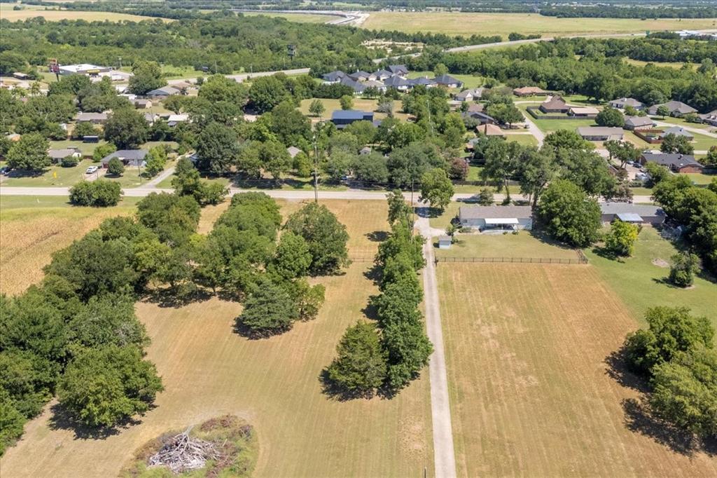 705 West Saunders Street Trenton, TX 75490 - Photo 3 of 37 an aerial view of residential houses with outdoor space and lake view