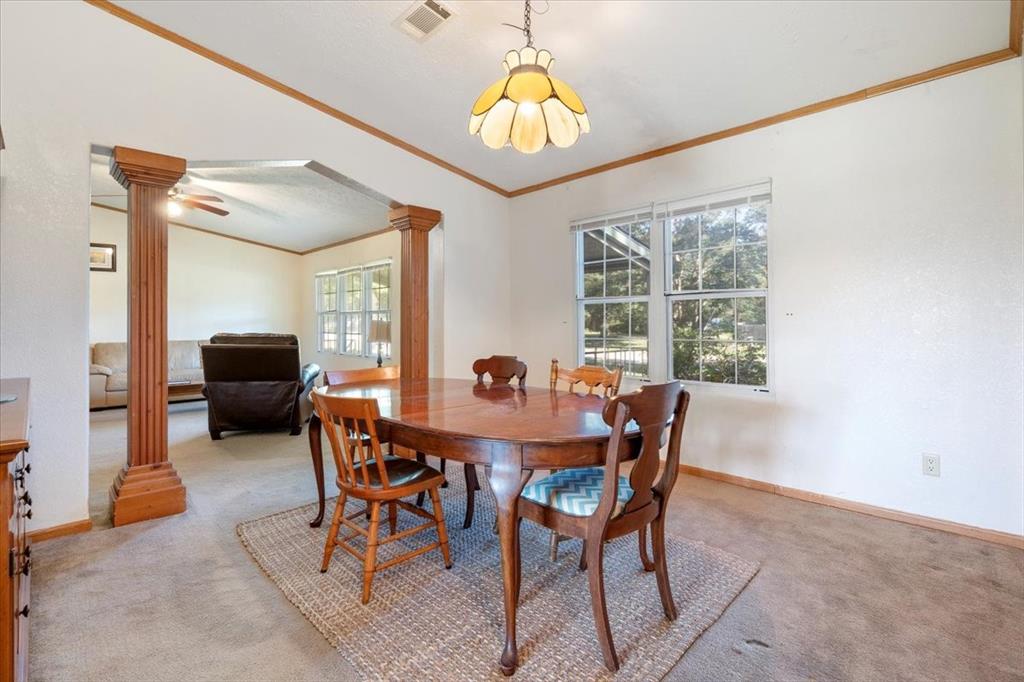 705 West Saunders Street Trenton, TX 75490 - Photo 9 of 37 a dining room with furniture and window