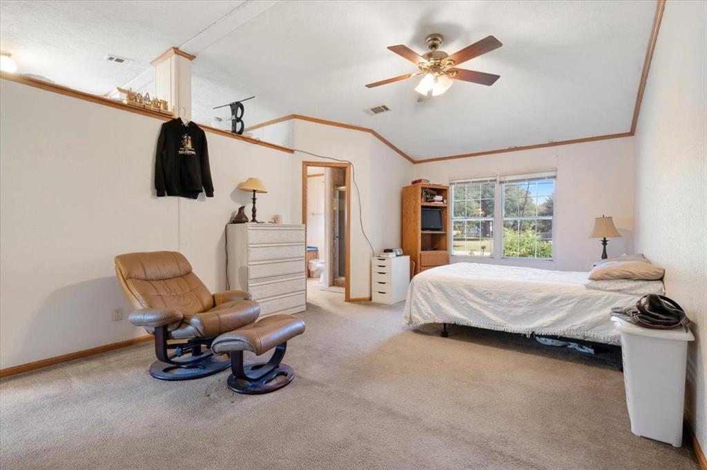 705 West Saunders Street Trenton, TX 75490 - Photo 10 of 37 a bedroom with furniture and a ceiling fan