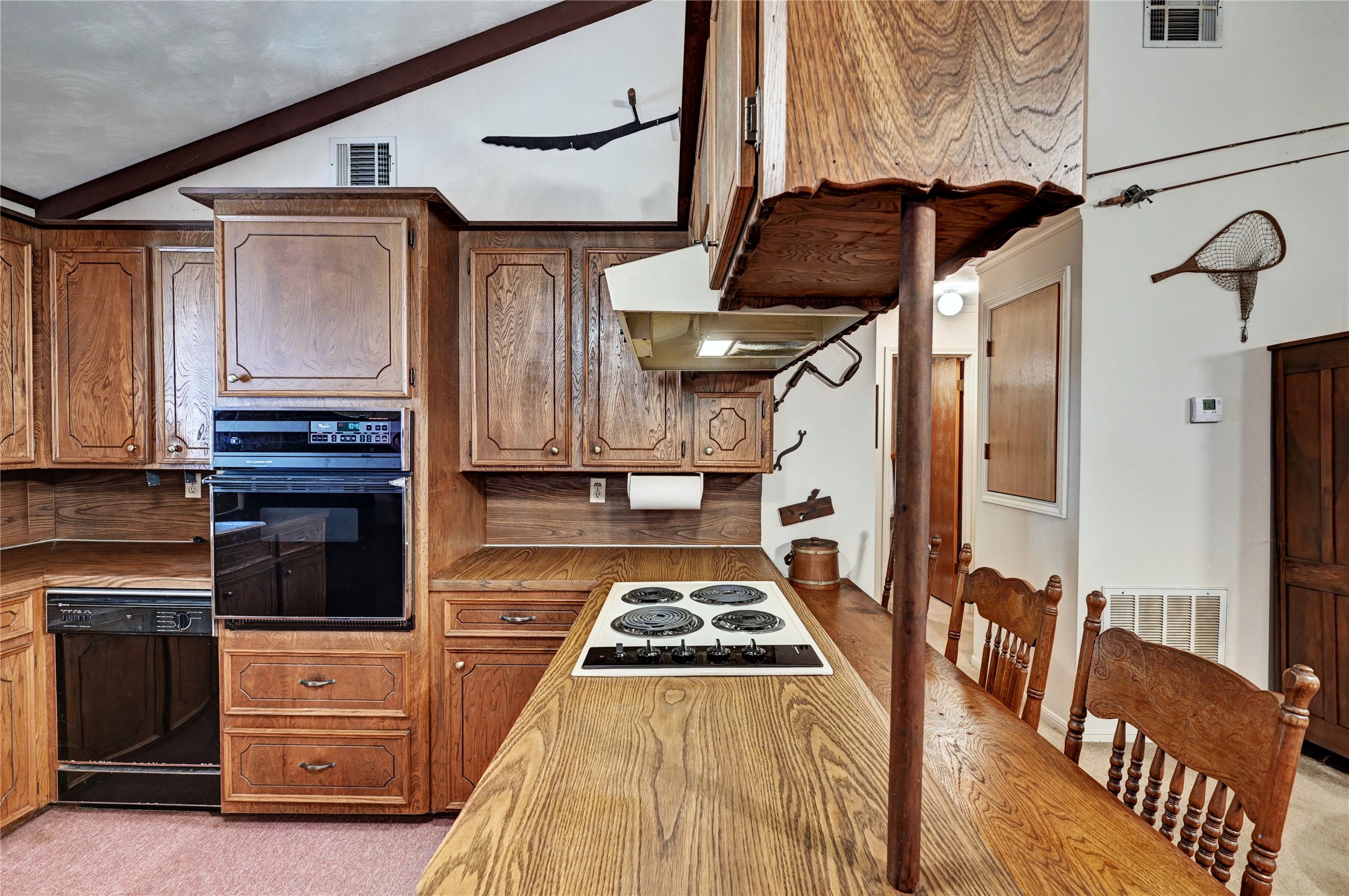 6 Hickory Hollow Road Huntsville, TX 77320 - Photo 25 of 44 a kitchen with stainless steel appliances granite countertop a stove and a refrigerator