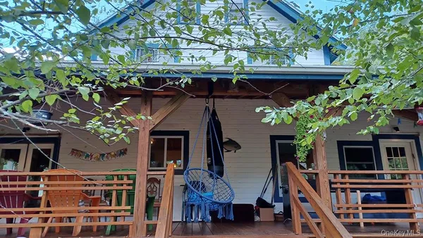 front view of a house with a tree