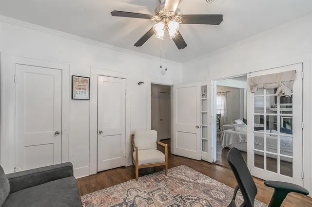 a spacious bedroom with a bed and a window