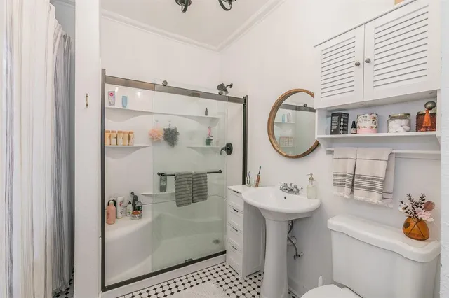 a view of a room that has a table and chairs