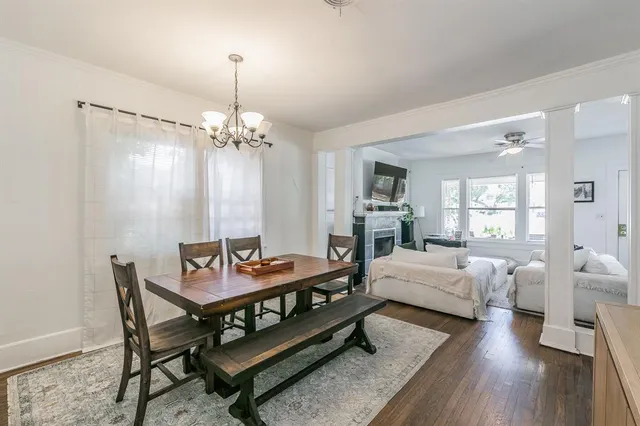 a view of a kitchen with refrigerator and a sink