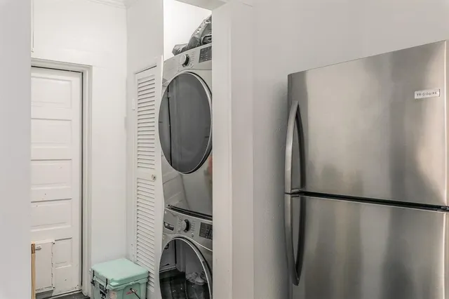 a view of a patio with table and chairs and wooden floor