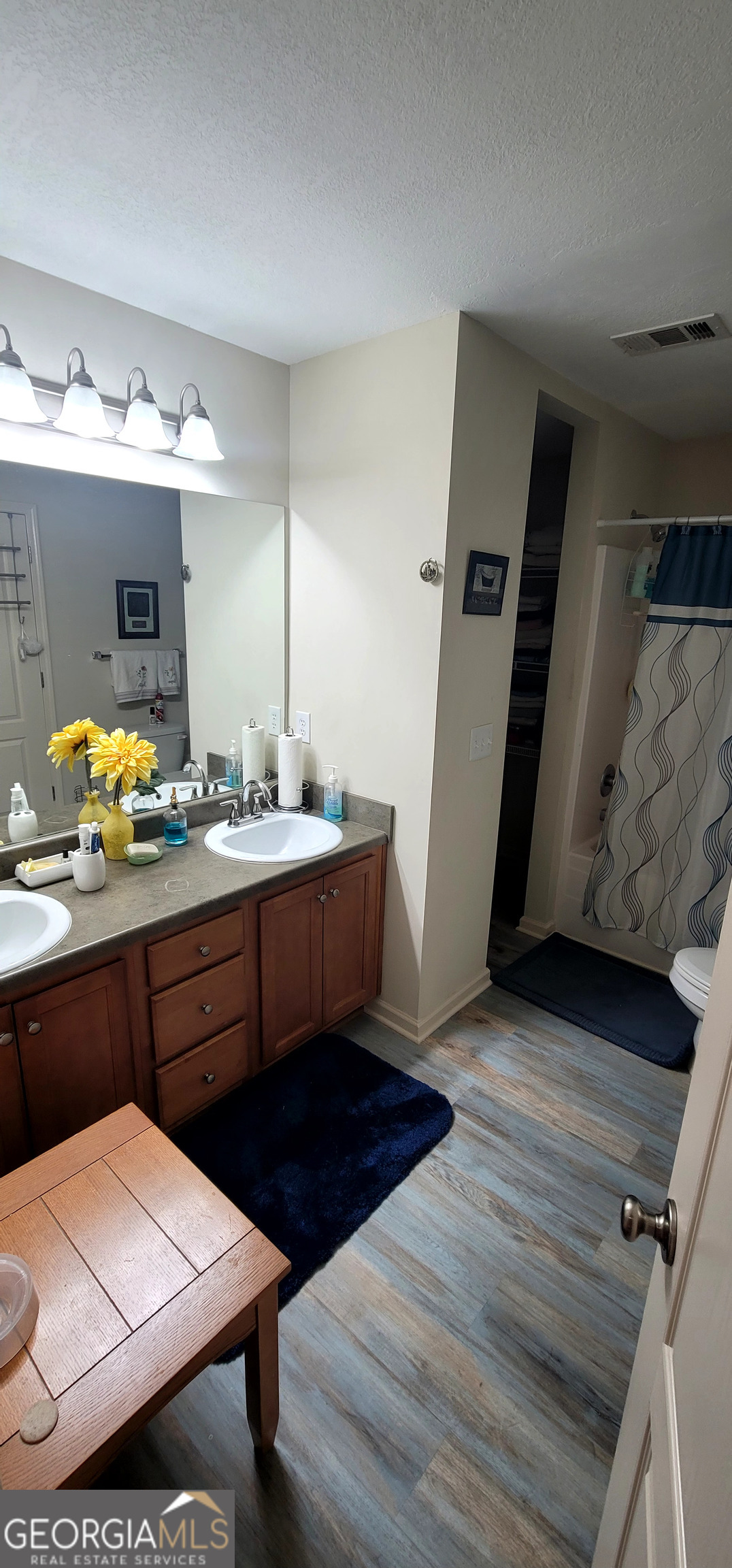 3181 Arbor Oaks Way Southwest Snellville, GA 30039 - Photo 11 of 12 a kitchen with a sink appliances and cabinets