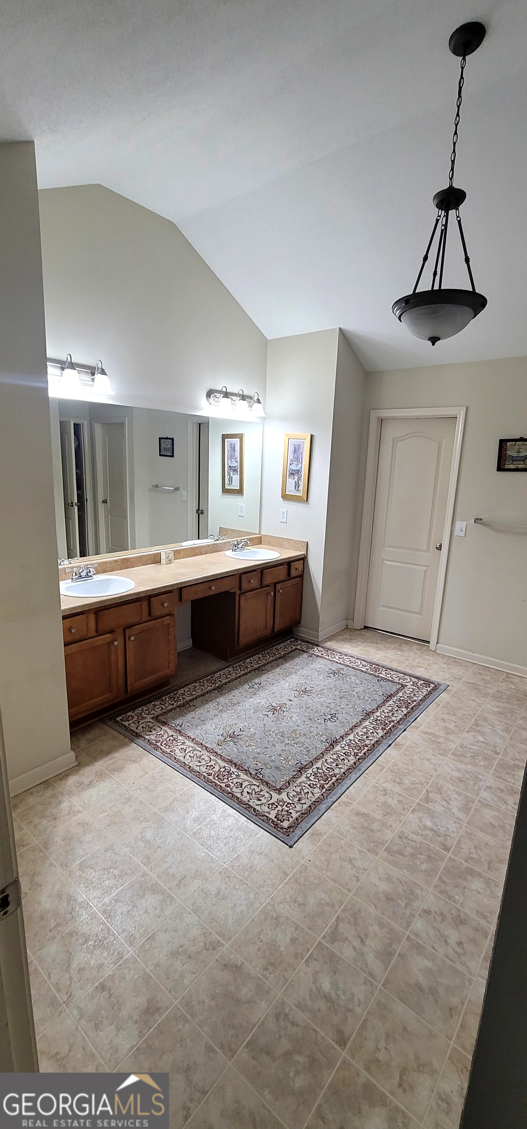 3181 Arbor Oaks Way Southwest Snellville, GA 30039 - Photo 6 of 12 a spacious bathroom with a tub sink and view