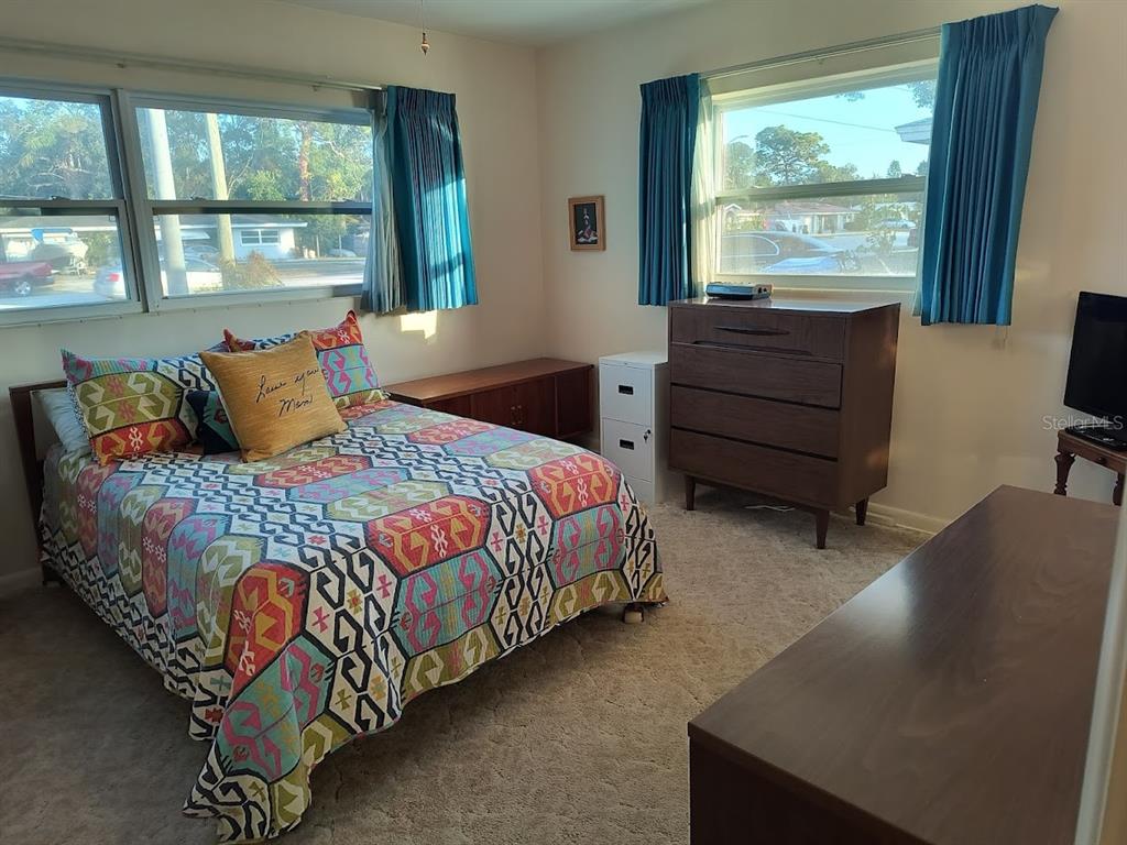 732 Keene Road Largo, FL 33771 - Photo 21 of 38 a bedroom with a bed and window