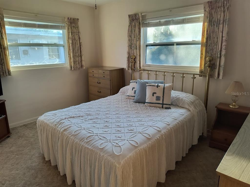 732 Keene Road Largo, FL 33771 - Photo 24 of 38 a bedroom with bed and window