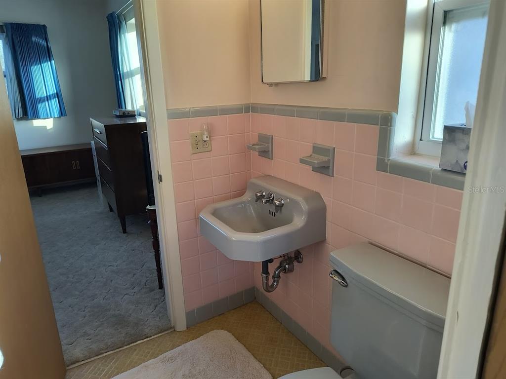 732 Keene Road Largo, FL 33771 - Photo 27 of 38 a bathroom with a sink and a mirror
