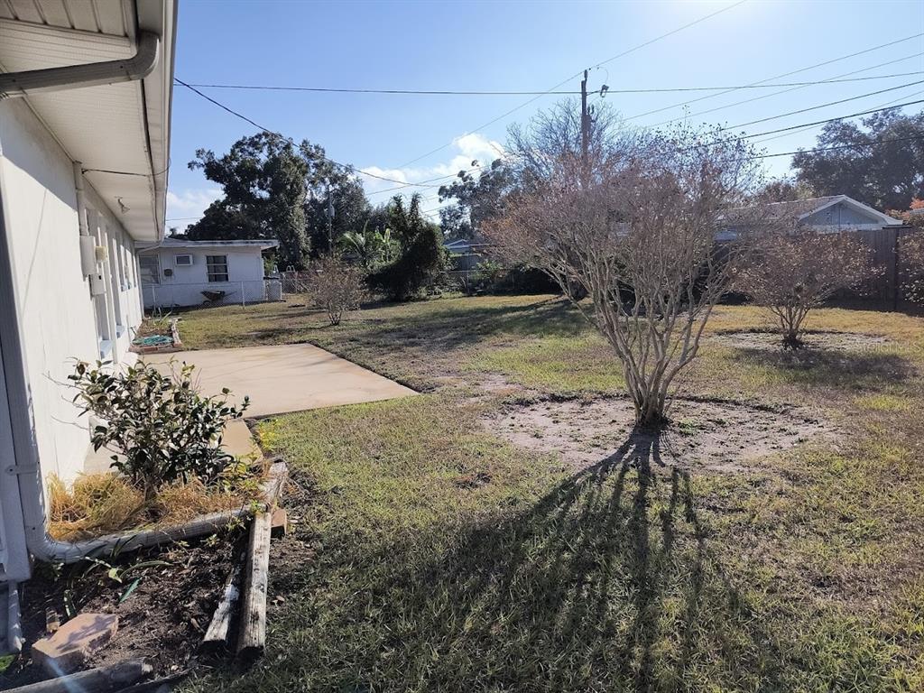 732 Keene Road Largo, FL 33771 - Photo 32 of 38 a view of a yard with plants and trees