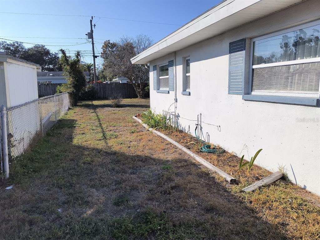 732 Keene Road Largo, FL 33771 - Photo 35 of 38 a view of a house with backyard and trees
