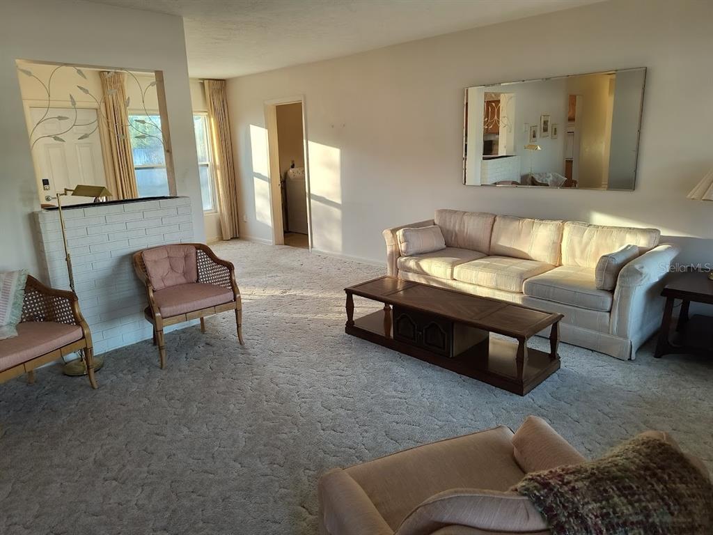 732 Keene Road Largo, FL 33771 - Photo 4 of 38 a living room with furniture and painting on the wall