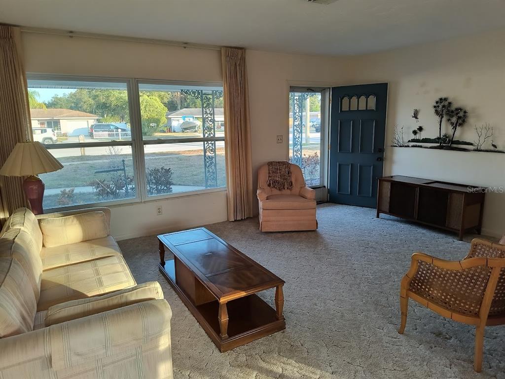 732 Keene Road Largo, FL 33771 - Photo 5 of 38 a living room with furniture and a large window