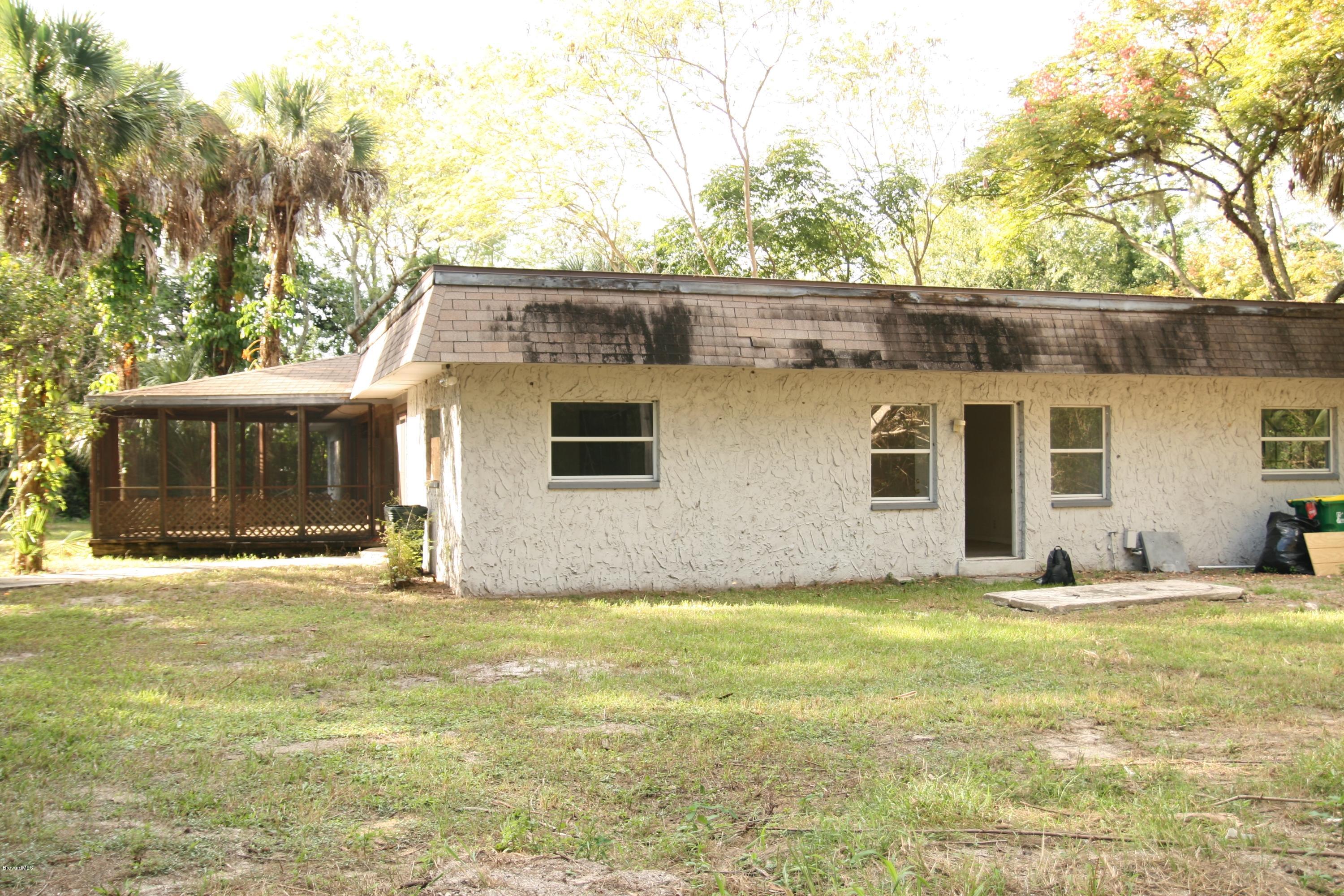 285 East Crisafulli Road Merritt Island, FL 32953 - Photo 14 of 25 left side and rear of home