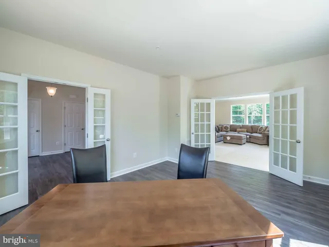 a bedroom with furniture and wooden floor