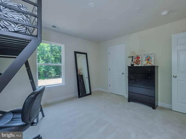 a view of room with furniture and a window