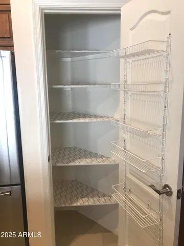 a view of an empty walk in closet