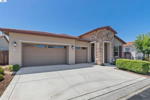 a front view of a house with a garage