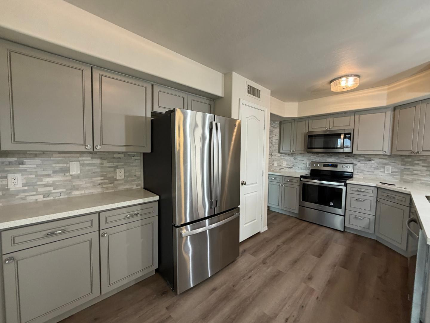 902 South Surfside Drive Gilbert, AZ 85233 - Photo 15 of 35 a kitchen with a refrigerator sink and microwave