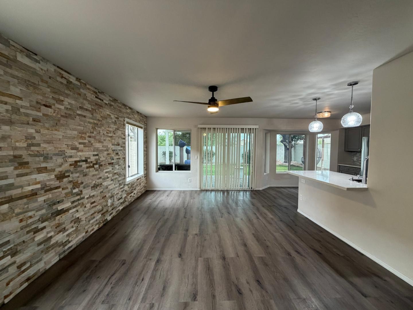 902 South Surfside Drive Gilbert, AZ 85233 - Photo 7 of 35 wooden floor in an empty room with a window