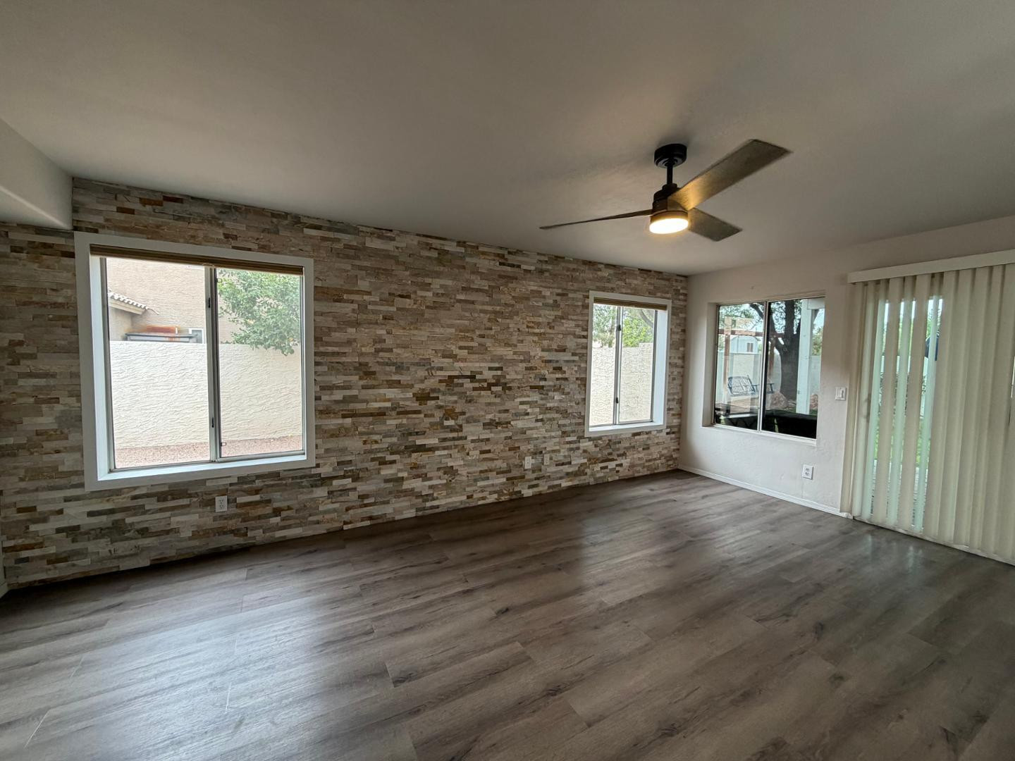 902 South Surfside Drive Gilbert, AZ 85233 - Photo 8 of 35 an empty room with wooden floor and windows