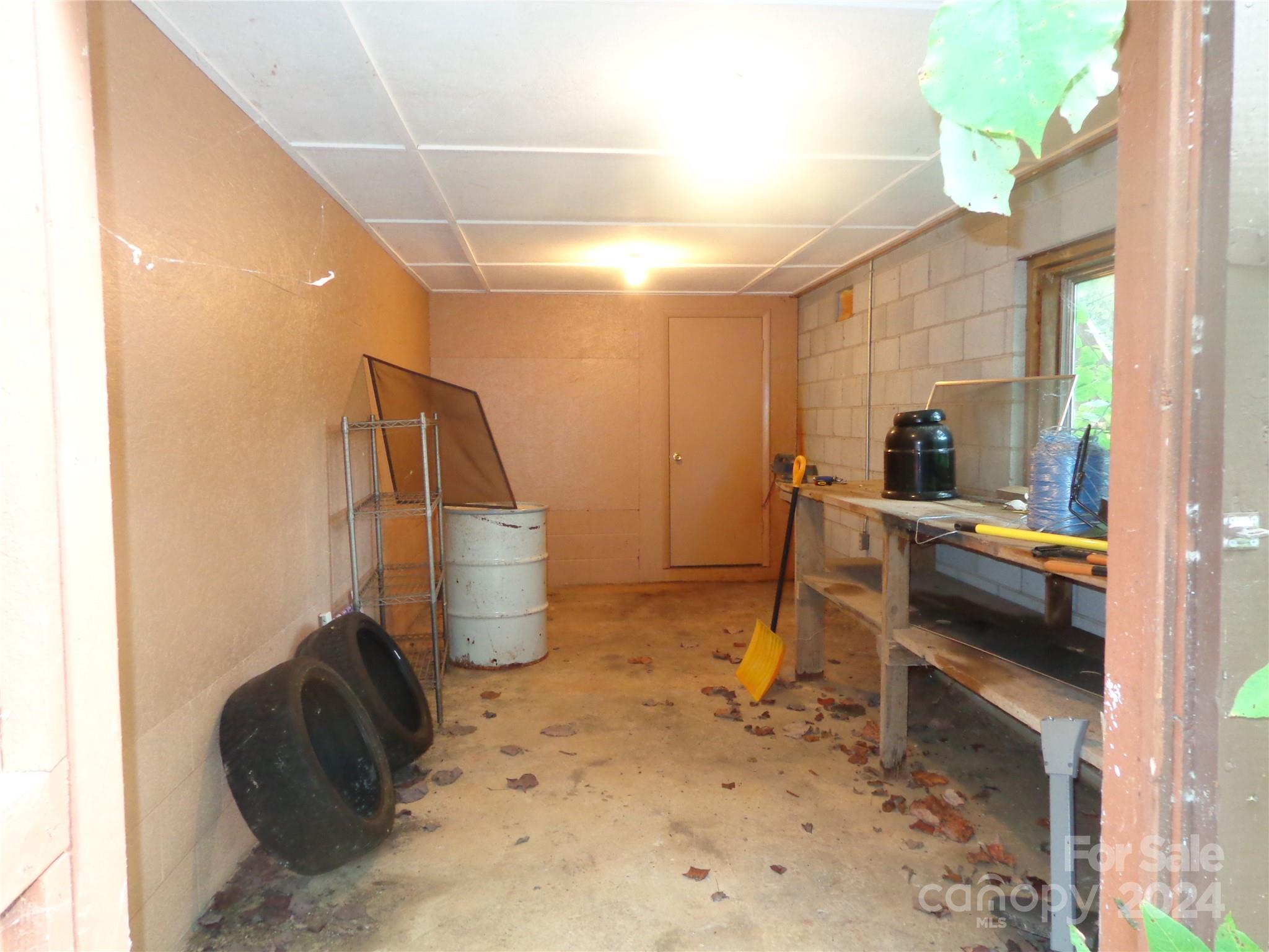 981 Rufus Robinson Road Sylva, NC 28779 - Photo 20 of 27 a kitchen with a sink and a stove top oven