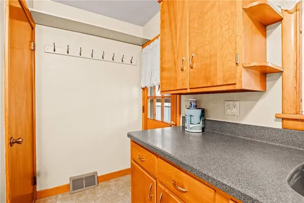 a kitchen with stainless steel appliances a sink and a window