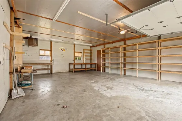 a view of a room with furniture and windows