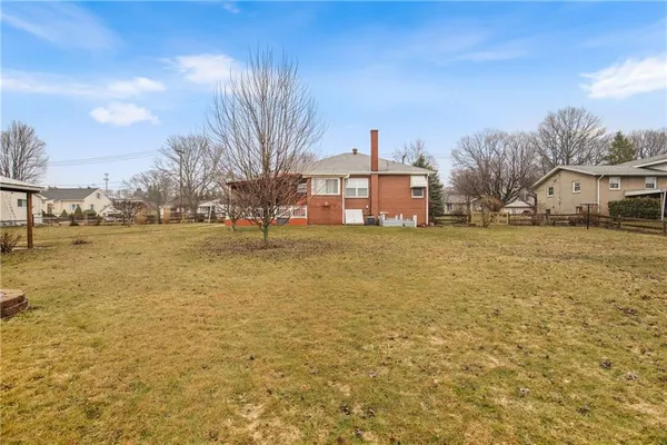 a front view of house with a yard