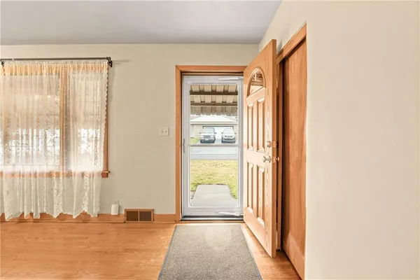 a view of a room with a large window