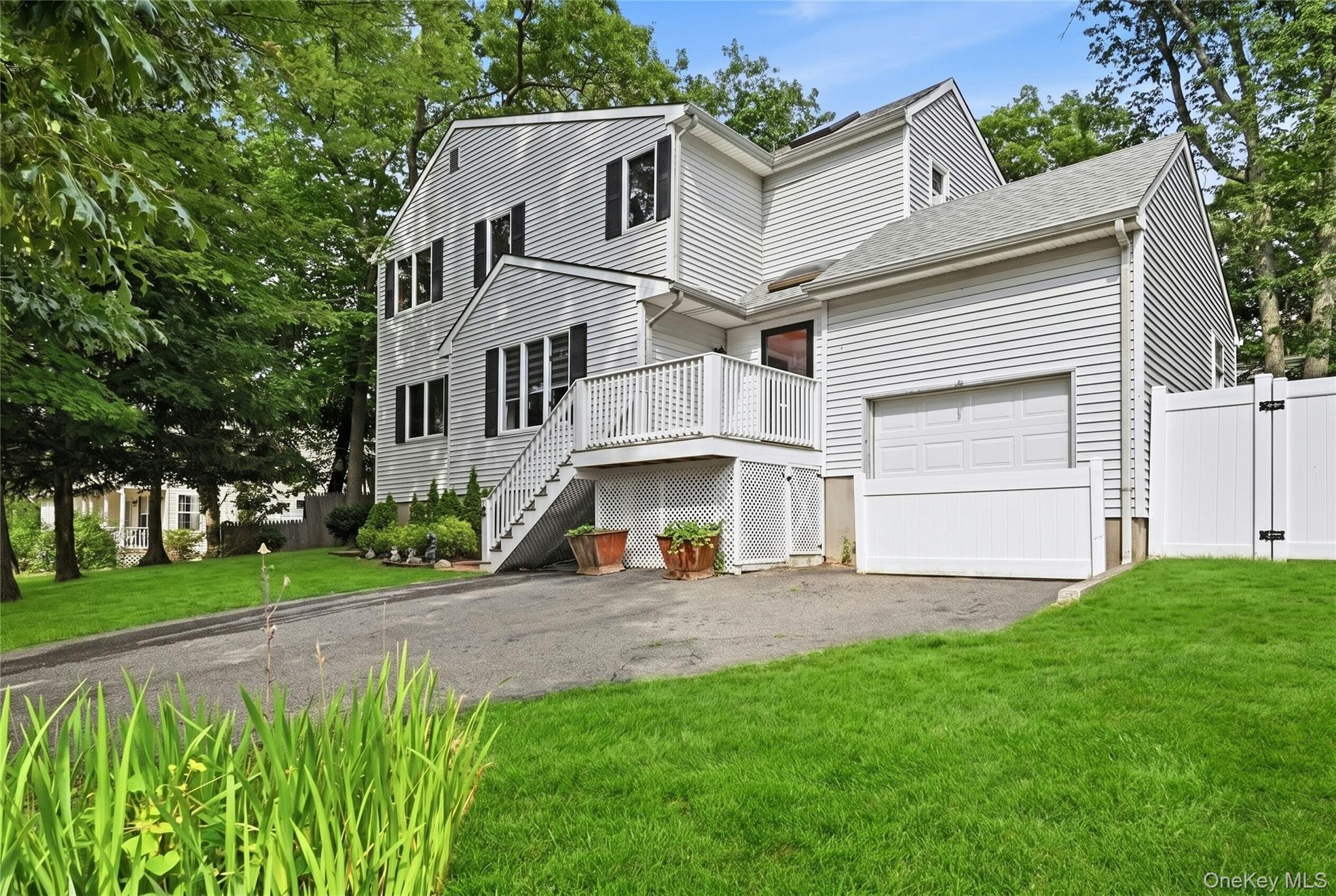 15 Birch Road Rocky Point, NY 11778 - Photo 1 of 30 Driveway and front yard (grass was digitally enhanced)