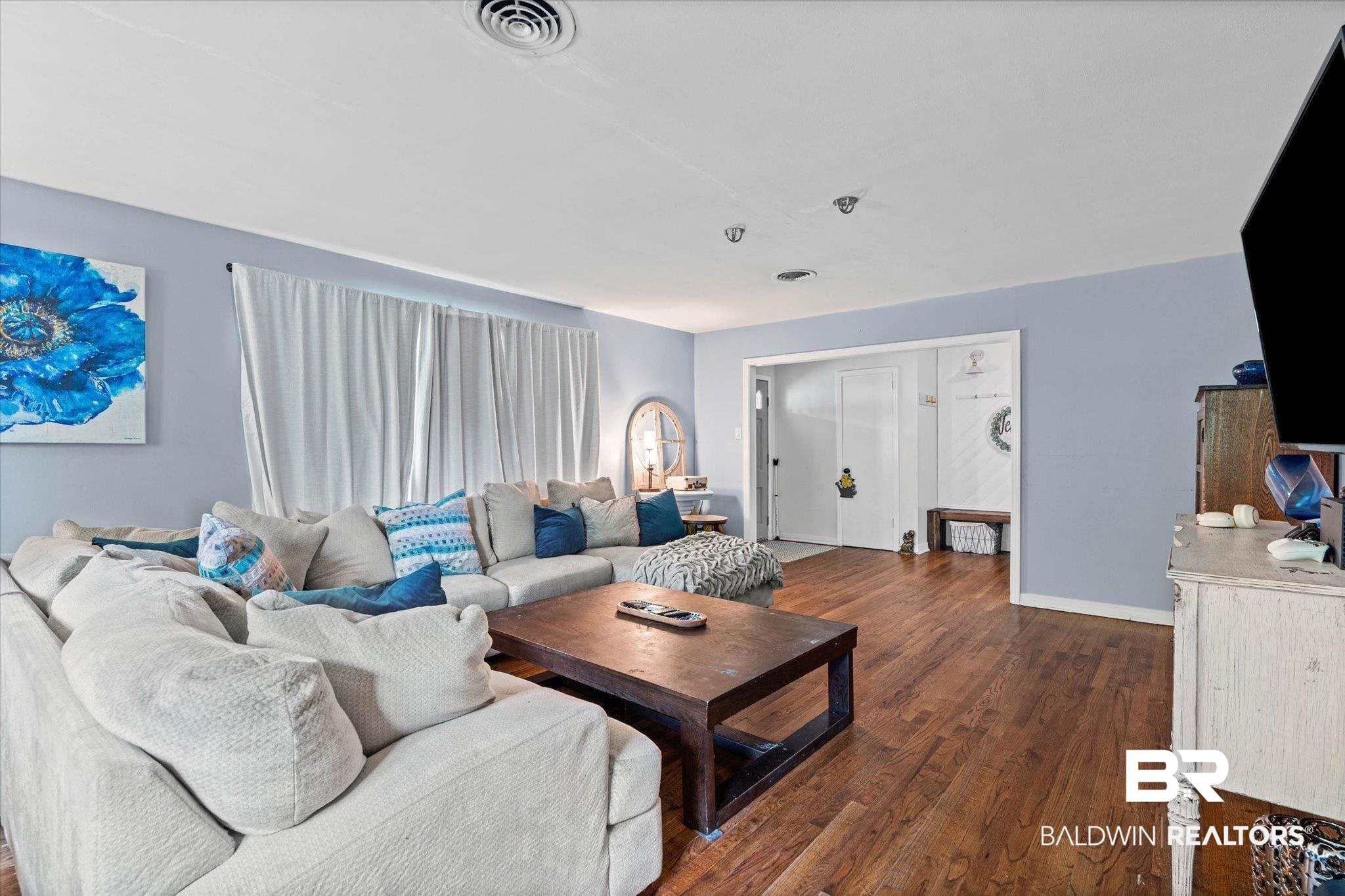 4213 Shan Drive East Mobile, AL 36693 - Photo 5 of 35 Spacious living area featuring wood-finish flooring, light blue wall paint, and recessed lighting