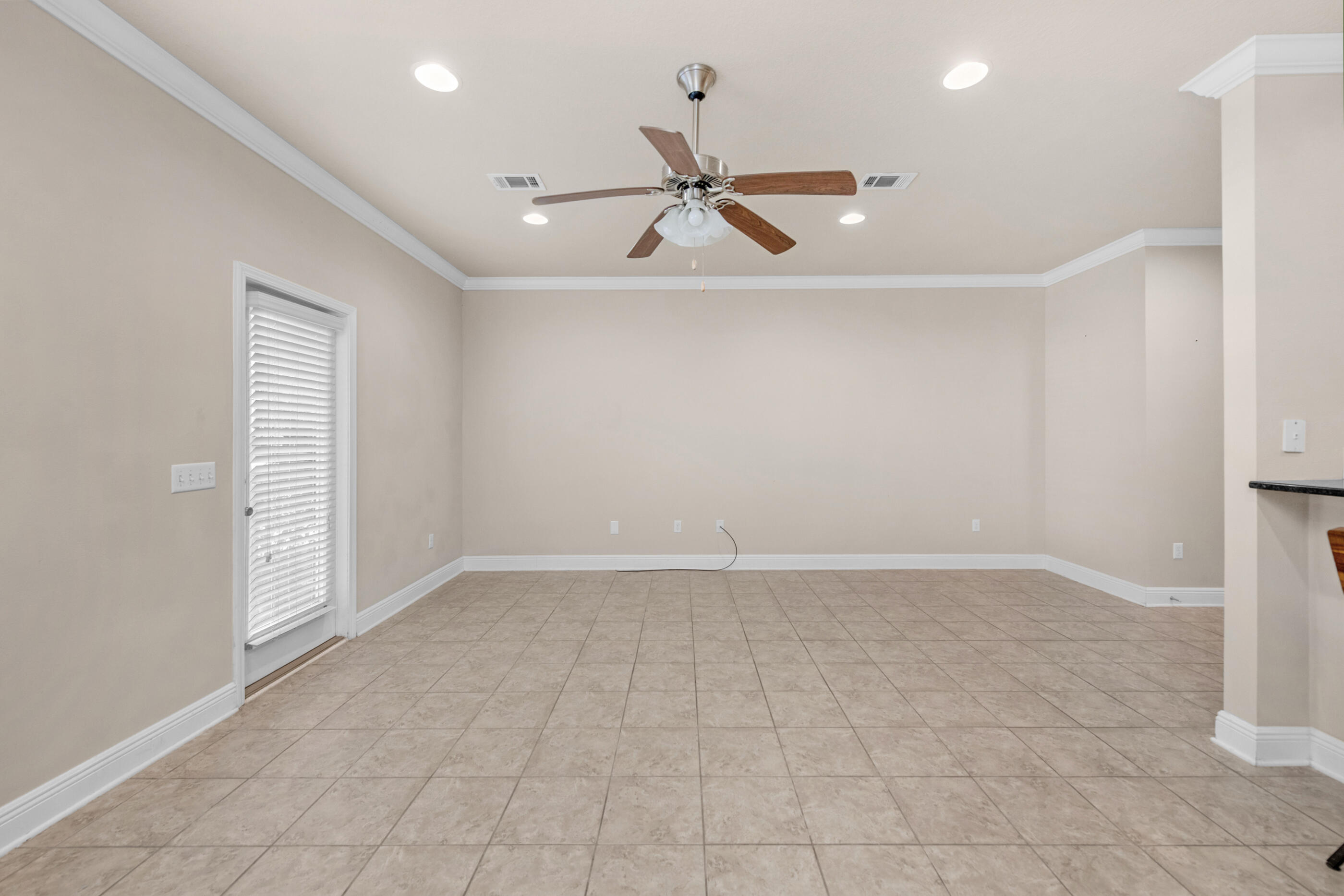 19 East Shady Oaks Lane, Unit E Santa Rosa Beach, FL 32459 - Photo 17 of 33 an empty room with windows and ceiling fan