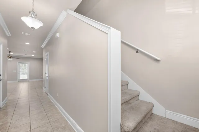 a view of a hallway with a white walls