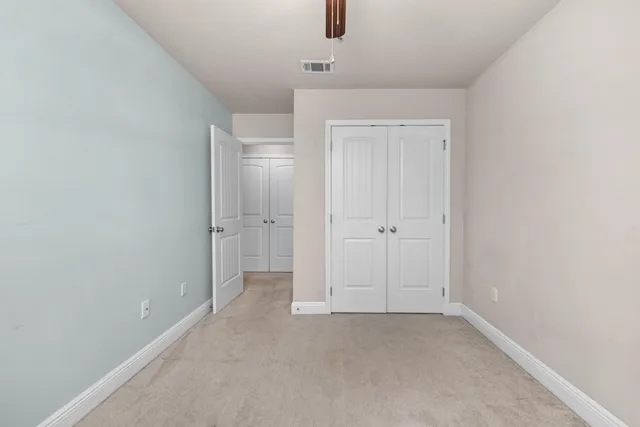 a bathroom with a shower toilet and sink