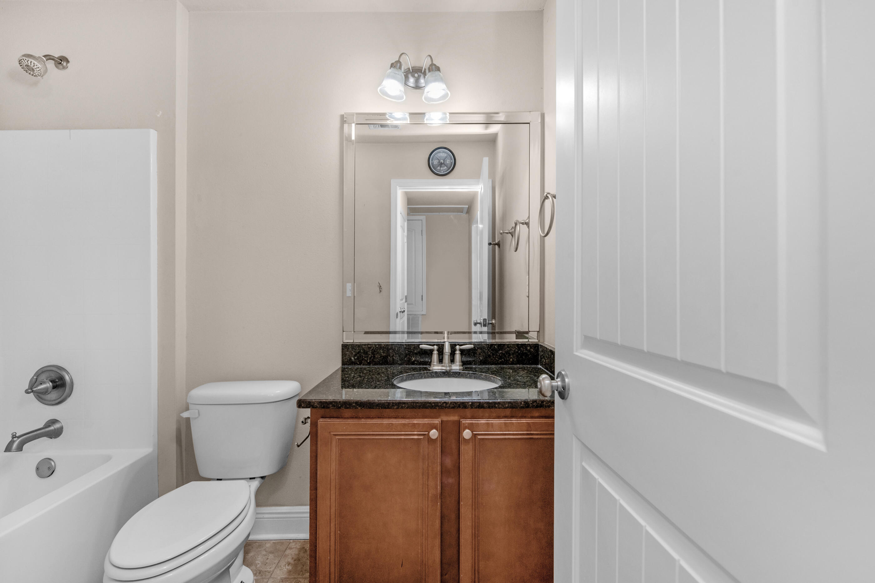 19 East Shady Oaks Lane, Unit E Santa Rosa Beach, FL 32459 - Photo 33 of 33 a bathroom with a granite countertop sink toilet and shower