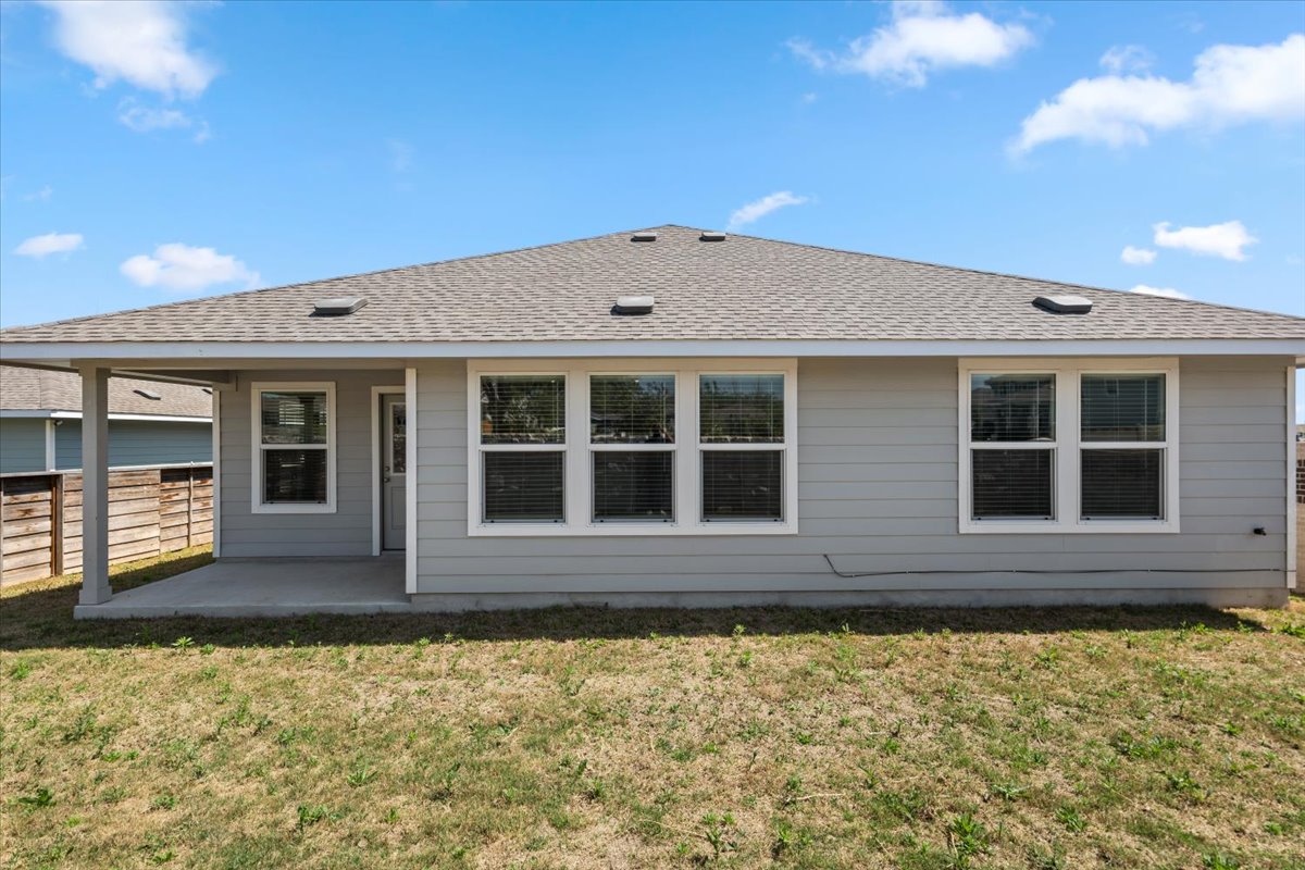 167 Jeffers Kyle, TX 78640 - Photo 4 of 40 Rear view of house with a patio area and roof with shingles