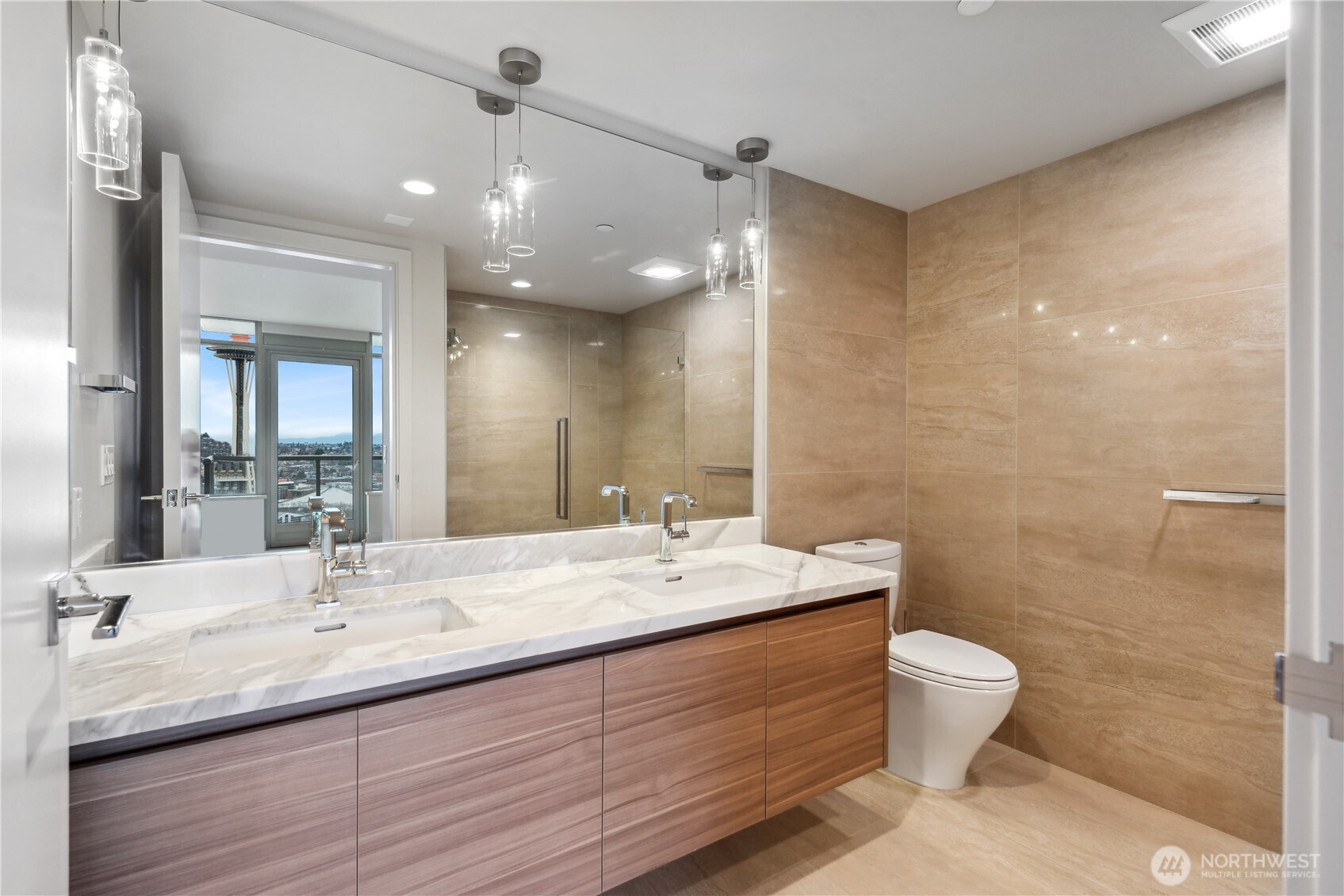 583 Battery Street, Unit 3103N Seattle, WA 98121 - Photo 13 of 39 a bathroom with a double vanity sink toilet and a mirror