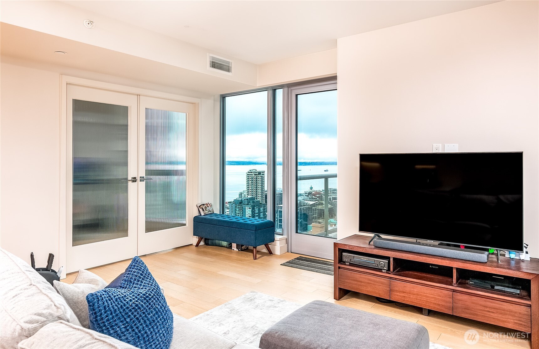 583 Battery Street, Unit 3103N Seattle, WA 98121 - Photo 20 of 39 a living room with furniture and a flat screen tv