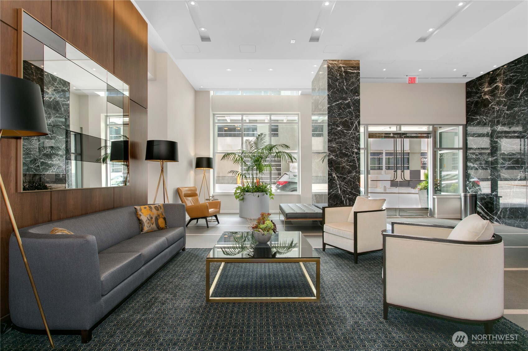 583 Battery Street, Unit 3103N Seattle, WA 98121 - Photo 25 of 39 a living room with furniture flat screen tv and a large window